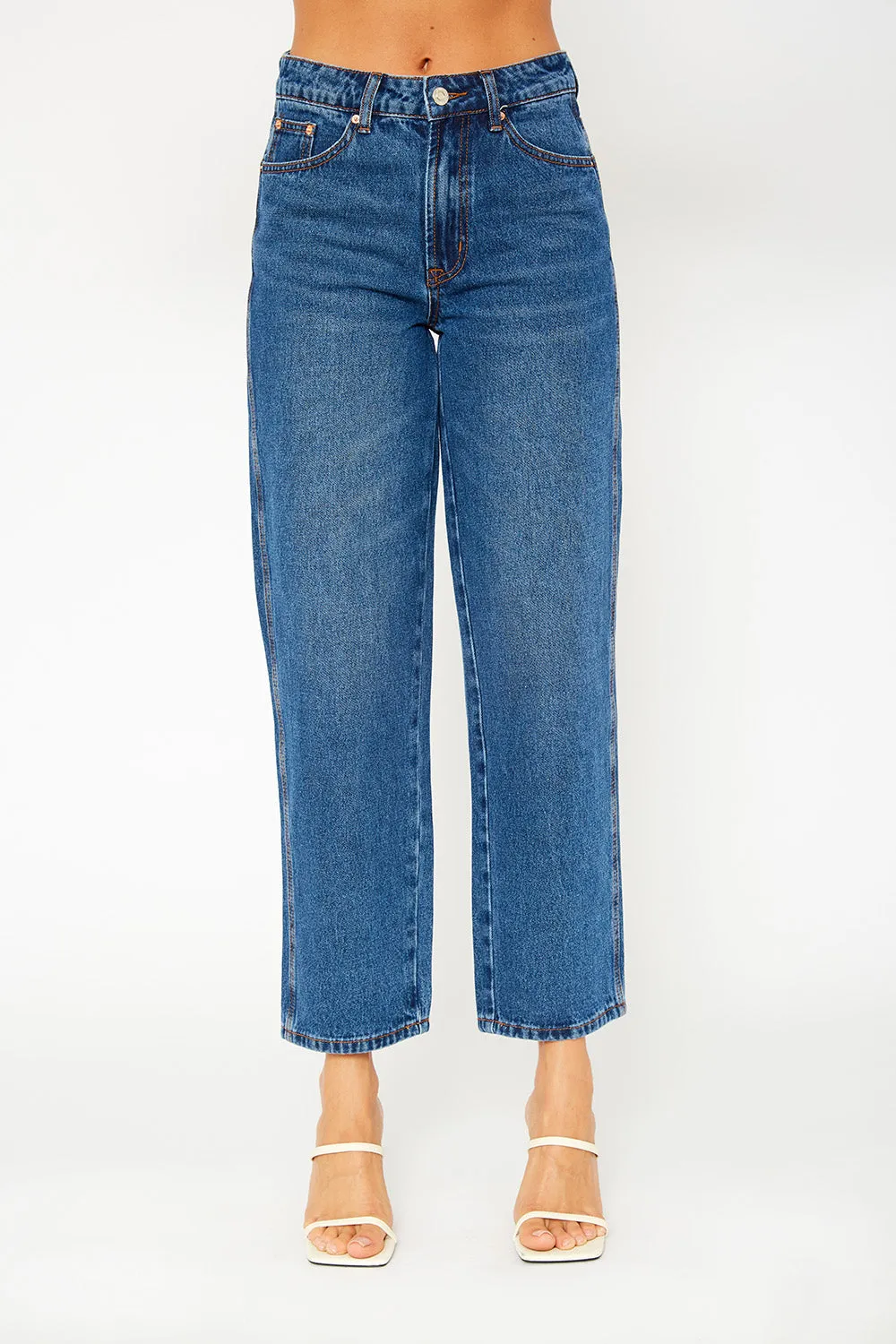 A high-rise dark blue dad fit jeans