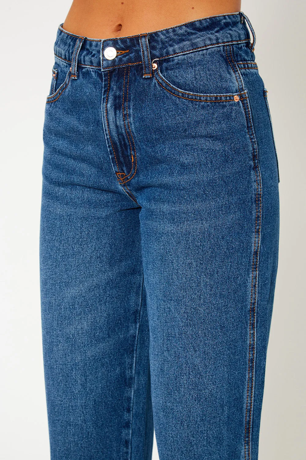 A high-rise dark blue dad fit jeans