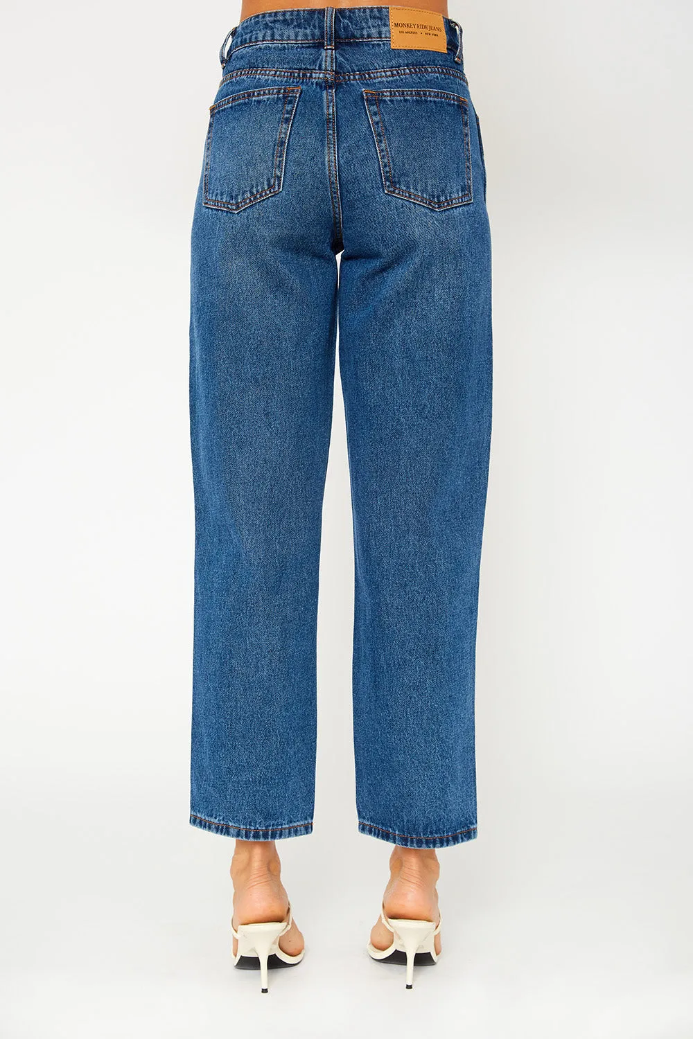 A high-rise dark blue dad fit jeans