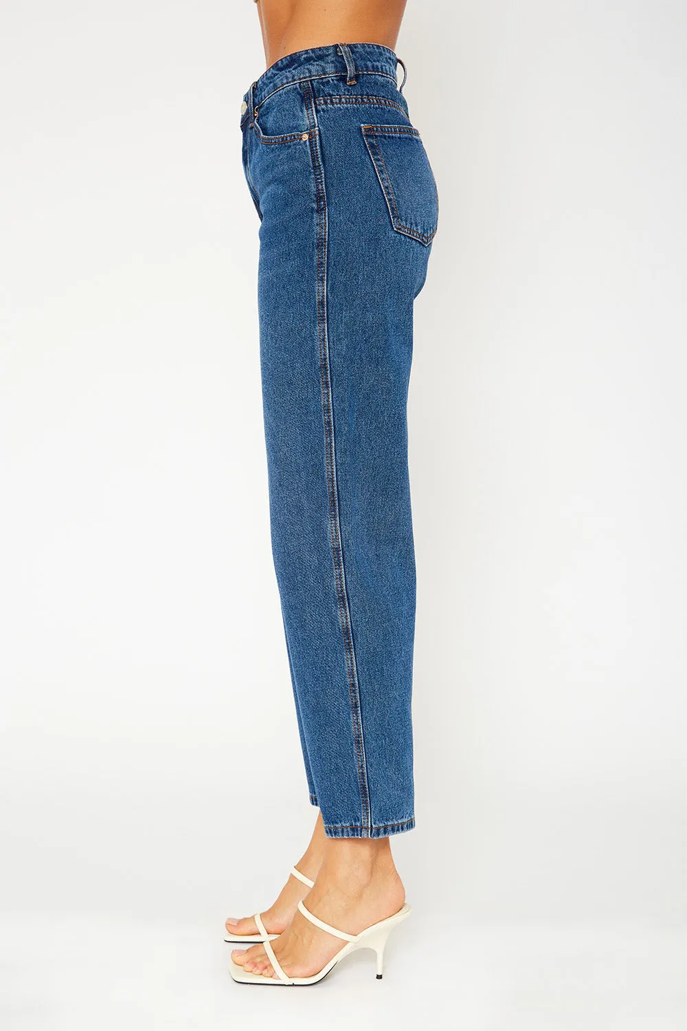 A high-rise dark blue dad fit jeans