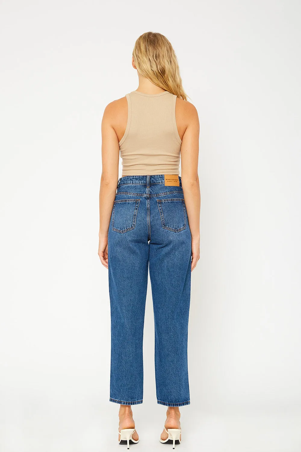 A high-rise dark blue dad fit jeans
